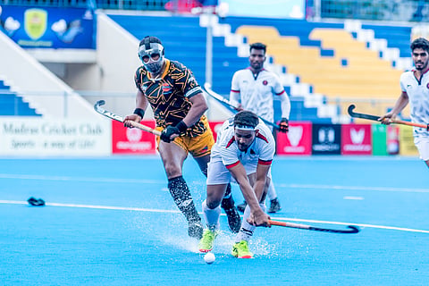 Indian Navy's Selvaraj K scoring a penalty corner against IOC