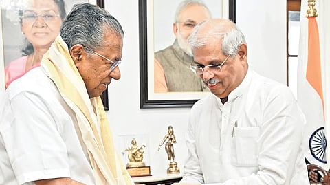 Governor Rajendra Arlekar greets Chief Minister Pinarayi Vijayan 
at Raj Bhavan in Thiruvananthapuram on Sunday.