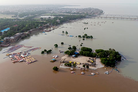 A floating platform jetty and changing rooms on the banks of the river Ganges are surrounded by floodwaters due to heavy monsoon rains, in Prayagraj, India, Saturday, July 19, 2025.