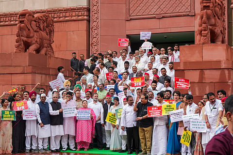 Opposition MPs stage a protest against the ongoing Special Intensive Revision (SIR) in Bihar, during the Monsoon session of Parliament, in New Delhi, Tuesday, July 22, 2025.