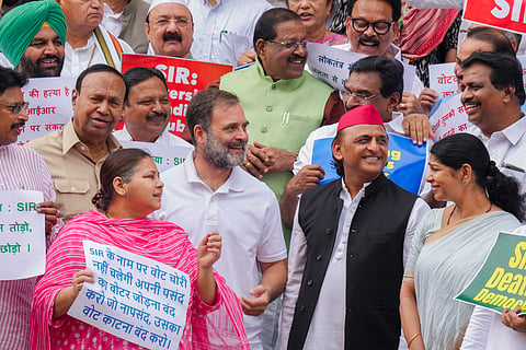 LoP in the Lok Sabha and Congress leader Rahul Gandhi with Samajwadi Party MP Akhilesh Yadav, RJD MP Misa Bharti, DMK MP Kanimozhi Karunanidhi and other INDIA bloc MPs stages a protest against the ongoing Special Intensive Revision (SIR) in Bihar, during the Monsoon session of Parliament, in New Delhi, Tuesday, July 22, 2025. 