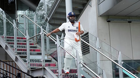 India's Rishabh Pant comes down the stairs with broken foot for batting on the second day at Old Trafford on Thursday