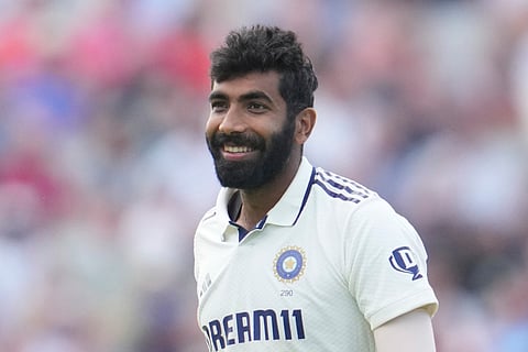 India's Jasprit Bumrah smiles as he celebrates the dismissal of England's Jamie Smith on the third day of the fourth cricket test match between England and India at Emirates Old Trafford, Manchester, England, Friday, July 25, 2025. 