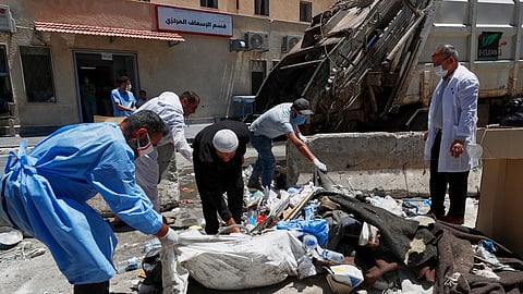 Workers clean the National Hospital following last week's sectarian clashes in the Druze-majority town of Sweida, Syria, on Friday, July 25, 2025. 