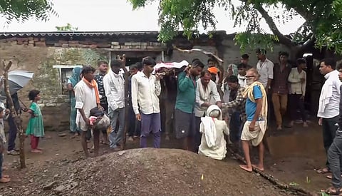  Family members carry the mortal remains of a child, who was killed after a portion of a government school collapsed on Friday, during the last rites, in Jhalawar district, Rajasthan, Saturday, July 26, 2025. At least seven children were killed and 27 injured in the incident, according to officials. 
