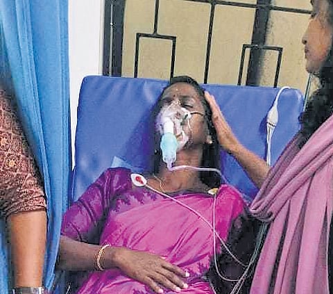 Kizhakkambalam panchayat president Mini Ratheesh undergoing treatment at a hospital at Pazhanganad on Sunday  
