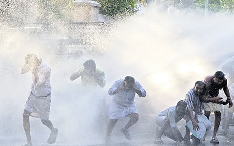 Police using water cannons on Youth Congress workers who protested in front of Raj Bhavan on Tuesday against the arrest of nuns in Chhattisgarh. 