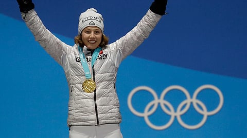 Women's 7.5km biathlon sprint gold medalist Laura Dahlmeier, of Germany, celebrates during the medals ceremony at the 2018 Winter Olympics in Pyeongchang, South Korea, Feb. 11, 2018. 