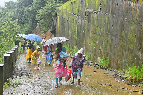 Residents living below the retaining wall are relocating to relief camps after large cracks appeared in the structure, raising fears of a possible collapse.