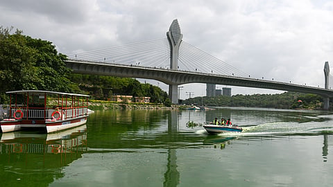 Tourists enjoy a boat ride at Durgam Cheruvu lake amdits a cloudy weather in Hyderabad. 
