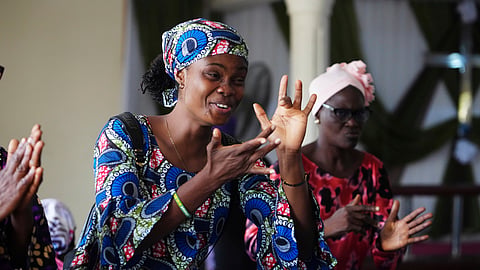 People interact using sign language during a church service at the Christian Mission for the Deaf in Lagos, Nigeria, Sunday, July 13, 2025.
