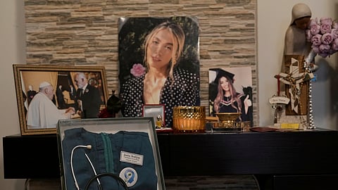 A display honoring Jessica Bezdjian, a nursing student who was killed in the massive 2020 blast at Beirut's seaport, shows her nursing uniform and personal items at her family's home in Bsalim, Lebanon, Saturday, Aug. 2, 2025. 
