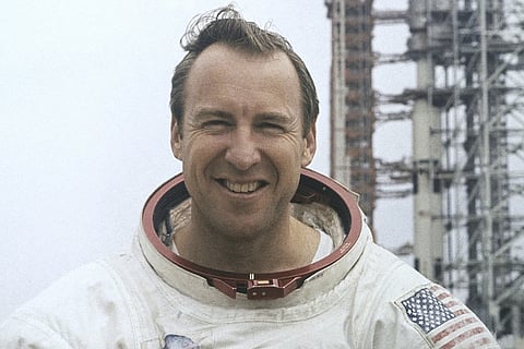 In this photo provided by NASA, astronaut James Lovell, Apollo 13 commander poses for a portrait in his space suit, Feb. 16, 1970.