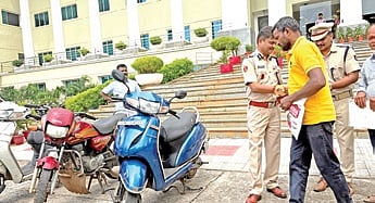 Police commissioner S Dev Datta Singh handing over the bikes to the owners 