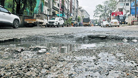 Potholes plague the PG Road stretch between Paradise and Sindhi Colony. 