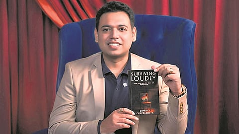 Supriyo Chakraborty with his book 'Surviving Loudly'