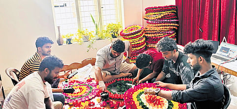 Friends and staff of Empire Creation preparing artificial pookalam.