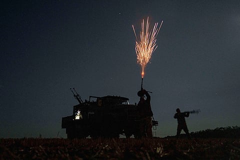 Ukrainian soldiers from air-defence unit of 59th brigade fire at Russian strike drones in Dnipropetrovsk region, Ukraine, Sunday, Aug. 10, 2025. 