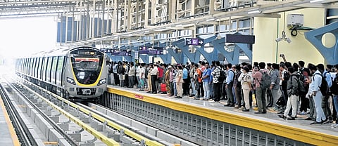 Passengers wait to board a Metro train at the RV Road Metro interchange station.