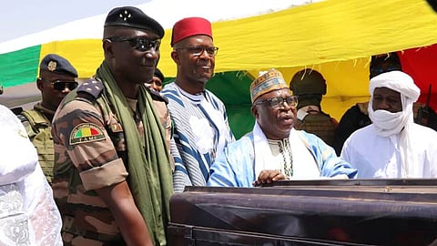 Members of the Malian government return boxes containing ancient Timbuktu manuscripts to the community elders in Timbuktu, Mali, Monday, Aug. 11, 2025. 