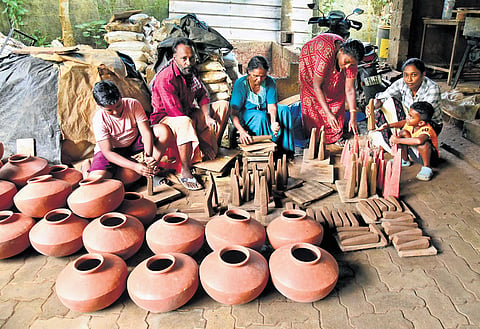 Thoppil Unni and his family engaged in crafting Onathappan ahead of the upcoming Onam festival.
