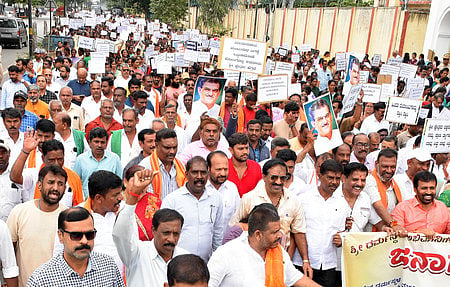 Devotees of the Dharmasthala temple alleging conspiracy and demanding "Save Dharmasthala Kshetra" in Mysuru on August 13. 