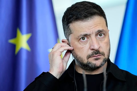 Ukrainian President Volodymyr Zelenskyy appears with German Chancellor Friedrich Merz following talks with European and U.S. leaders in Berlin, Germany, Wednesday, Aug. 13, 2025. 