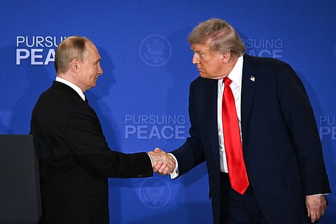 US President Donald Trump (R) and Russian President Vladimir Putin shake hands at the end of a joint press conference after participating in a US-Russia summit on Ukraine at Joint Base Elmendorf-Richardson in Anchorage, Alaska, on August 15, 2025.