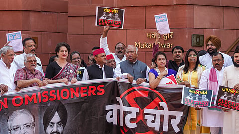 LoP in the Rajya Sabha and Congress President Mallikarjun Kharge, party MP Priyanka Gandhi Vadra, and Samajwadi Party President and MP Akhilesh Yadav, along with other MPs from the INDIA bloc, participate in a protest against the Election Commission's Special Intensive Revision (SIR) of electoral rolls in Bihar, during the Monsoon session of Parliament, in New Delhi, Tuesday, Aug. 19, 2025. 