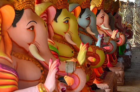 Rows of brightly painted Vinayagar (Ganesha) idols nearing completion ahead of Vinayagar Chaturthi celebrations.
