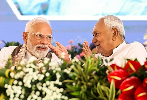 In this image released on Aug. 22, 2025, Prime Minister Narendra Modi and Bihar Chief Minister Nitish Kumar during a public meeting, in Gayaji.