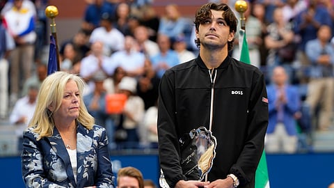 Taylor Fritz, of the United States, holds the finalist trophy after losing to Jannik Sinner, of Italy, in the men's singles final of the U.S. Open tennis championships, Sept. 8, 2024, in New York. 