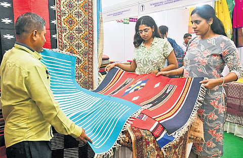 People checking out the carpet collection at the expo 
