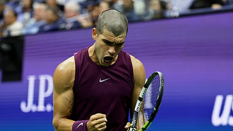 Carlos Alcaraz, of Spain, reacts against Reilly Opelka, of the United States, during the first round of the US Open tennis championships, Monday, Aug. 25, 2025, in New York.