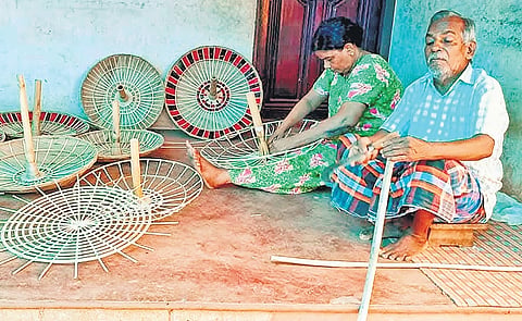 Govindhan and Lalitha, artisans of palm leaf umbrellas