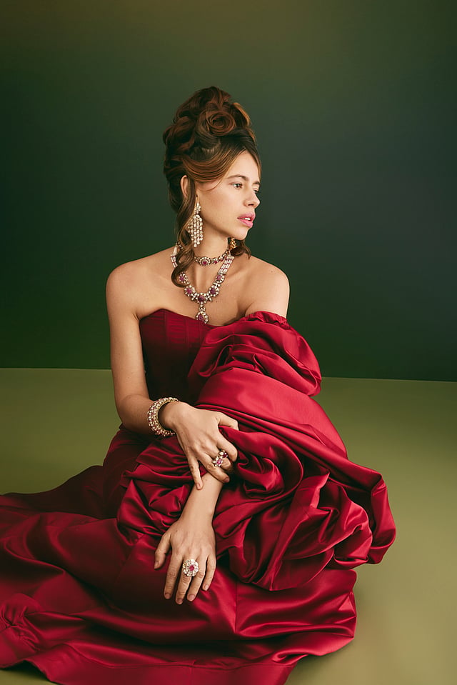 kalki red dress Deep Red Embellished Trail Gown A silhouette steeped in allure, this deep wine creation fuses mystery with command. The sculpted bodice embraces the form like armor, while the daring slit adds a
