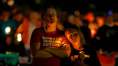 People gather at a vigil at Lynnhurst Park after a shooting at the Annunciation Catholic School Wednesday, Aug. 27, 2025, in Minneapolis. 