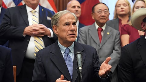 Texas Gov. Greg Abbott speaks to the media following a bill signing as Texas senators debate a bill on a redrawn U.S. congressional map during a special session in the Senate Chamber at the Texas Capitol in Austin, Texas