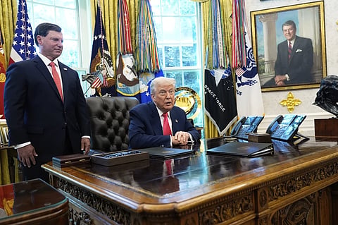 Social Security Commissioner Frank Bisignano, left, listens as President Donald Trump speaks during event in the Oval Office to mark the 90th anniversary of the Social Security Act, Thursday, Aug. 14, 2025, in Washington. 
