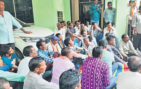 Farmers staging protest at the DRCS office in Bargarh on Monday 