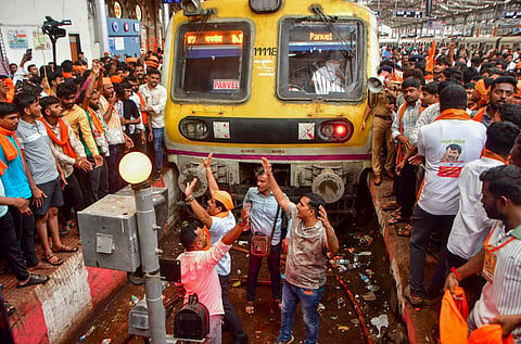 Maratha community members stop a train during their protest seeking reservation for the community under the Other Backward Classes (OBC) category, at Chhatrapati Shivaji Maharaj Terminus (CSMT) in Mumbai, Monday, Sept. 1, 2025. 