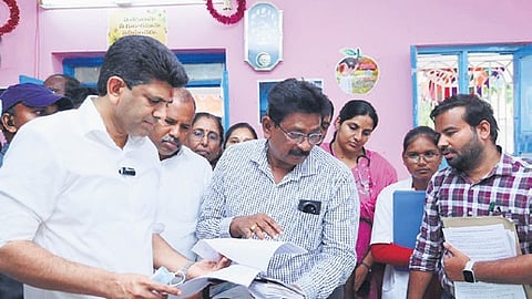 Union Minister of State for Rural Development and Communication Dr. Pemmasani Srinivas, along with MLA B. Ramanjaneyulu, interacts with residents during an inspection of the state-run health camp in Turakapalem on Friday. 