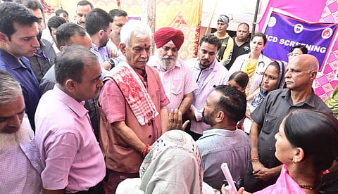 Sinha visited Rajiv Colony, where a health camp was being held for flood-affected families.