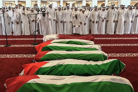This grab from footage released by Qatar TV shows Qatar's Emir Sheikh Tamim bin Hamad Al-Thani attends the funeral of people killed in an Israeli strike on figures of the Palestinain Hamas movement two days earlier, at Sheikh Mohammed bin Abdul Wahhab Mosque in Doha on September 11, 2025.