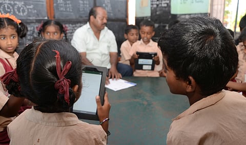 Students trying to access study materials online using smart devices 