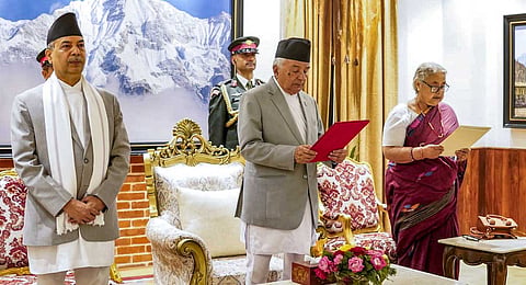 In this image received on Sept. 12, 2025, Nepal's President Ramchandra Paudel administers the oath of office to Sushila Karki as Prime Minister during a ceremony at the President's residence, in Kathmandu, Nepal.