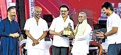 Chief Minister MK Stalin handing over a memento to Ilaiyaraaja as Deputy CM Udhayanidhi Stalin and actors Kamal Haasan and Rajinikanth look on 