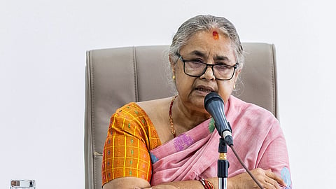 Newly elected Prime Minister of Nepal's interim government Sushila Karki speaks with officials at the prime minister's office in Kathmandu on September 14, 2025.