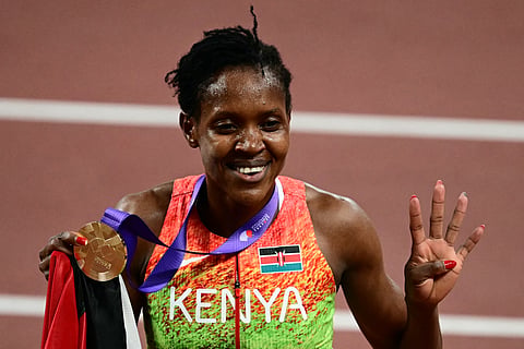 Kenya's Faith Kipyegon celebrates after winning the women's 1500m final during the World Athletics Championships in Tokyo.