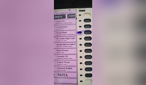  The EVM with an ink mark on the ABVP’s presidential candidate, Aryan Mann at the Delhi University Students’ Union election on 18,  September 2025. 